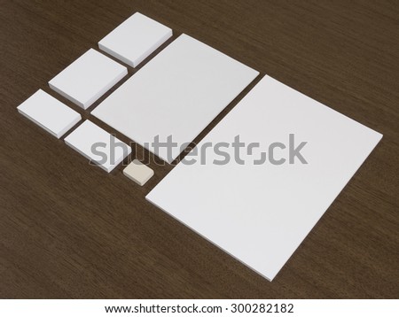 Empty set of corporate identity templates. Business cards, blocks of papers and eraser.