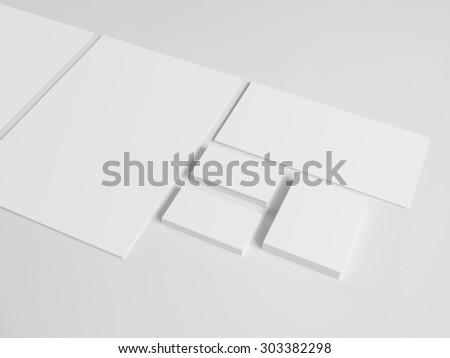 Envelopes business card folder on gray background. Notepad and pile of documents.