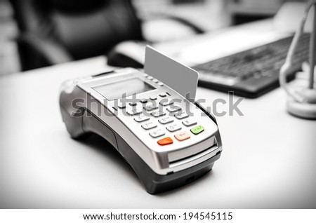 Bank terminal and payment card on the office table