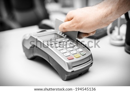 Human hand holding plastic card