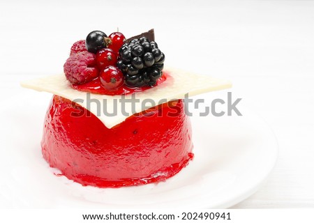 Cheese cake with berries on white background