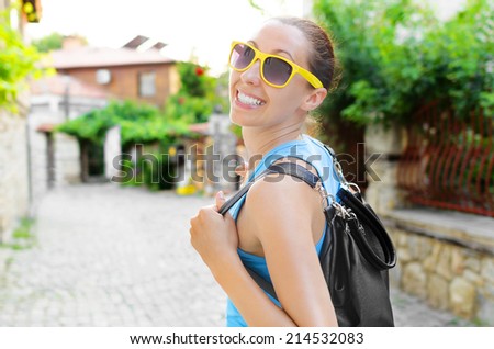 Attractive girl tourist, smiling walking outdoors