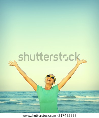 Woman pulls hands to the sky. Freedom - conceptual photography.