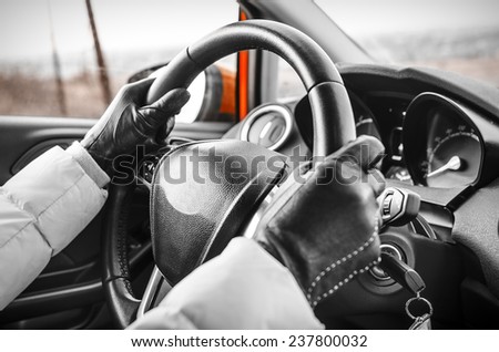 Hands on a steering wheel