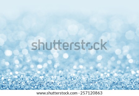 Abstract blue glitter background. Shiny glitter bokeh christmas background.