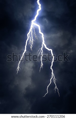Lightning strike on the dark cloudy sky