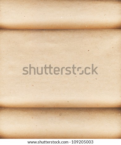 scroll of paper rough brown cardboard in rolls and place for your text