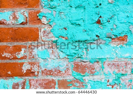 Bright stylish impressive a red brick with traces of the fallen off blue green oil color
