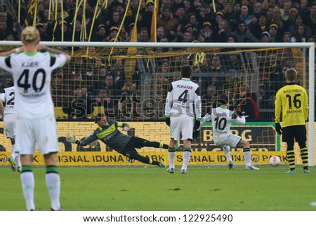 DORTMUND - DEC 8: VfLs Diego scores a penalty against BVBs Roman Weidenfeller during a match between Borussia Dortmund & VfL Wolfsburg, final score 2 - 3, on Dec 8, 2012, in Dortmund, Germany.
