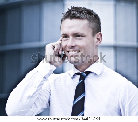 Photo Of A Young Corporate Man On Cellular Phone