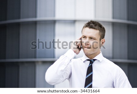 Photo Of A Busy Corporate Man On The Cell Phone