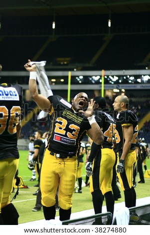 FRANKFURT - OCT 3:  Running back of Berlin Adlers Albert Thompson cheers for the audience at German Bowl XXXI on Oct 3, 2009 in Frankfurt, Germany.