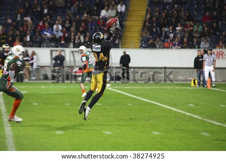 FRANKFURT - OCT 3: Wide Receiver of Berlin Adlers Johnny Schmuck cathes the ball at German Bowl XXXI on Oct 3, 2009 in Frankfurt, Germany.