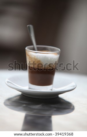 Photo Of A Glass Of Cappuccino With Foamy Cream