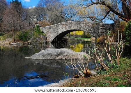 Quiet Moment at Gapstow Bridge, Central Park - Serene view of Gapstow Bridge and the Duck Pond in the fall in Central Park, New York City.  A quiet moment away from city life.