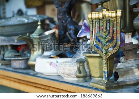 An old Menorah and other Judaica and artifacts in an antique store in Jaffa, Tel Aviv, Israel