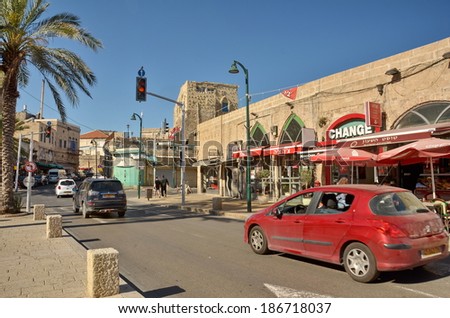 JAFFA, ISRAEL - APR 11, 2014: Cars and people in the main steet in the old city of Jaffa, Tel Aviv, Israel