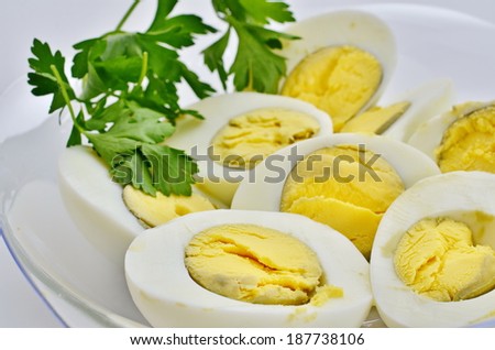 Hard egg halves decorated with parsley - a traditional Passover food normally dipped in salt water and eaten before the meal