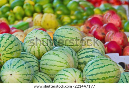 Fresh Israeli watermelons and other colorful produce in a Jerusalem fruit and vegetable market