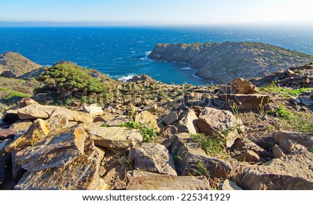 The wind beaten and dry rocky landscape of the Cape in Cap de Creus peninsula, Catalonia, Spain.  This extraordinary landscape inspired some Salvador Dali works.
