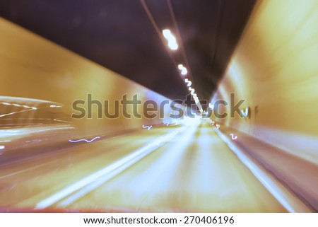 Cars in a tunnel - Snow shutter speed abstract car tunnel effect showing motion and speed