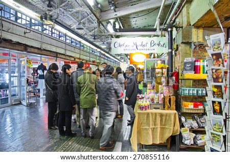 NEW YORK - MARCH 9, 2015: People shopping in Chelsea Market, Manhattan, New York City - long exposure.  The Market is an enclosed urban food court, shopping mall, and television production facility.