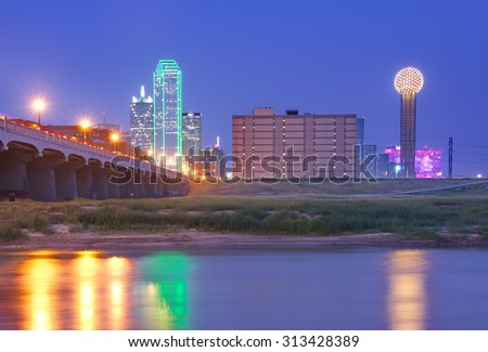 Downtown Dallas, Texas skyline at night, the Commerce Street Bridge, reflecting in the Trinity River