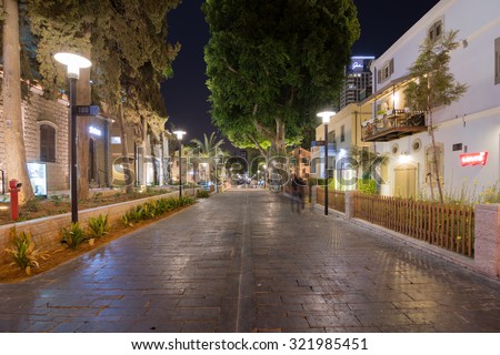 TEL AVIV - SEPT. 25, 2015: Tel Aviv Night Life - Restored houses at night at the hip Sarona district featuring rich night life and conserved Templer era German architecture from the late 1800\'s
