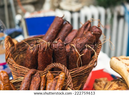 Homemade smoked sausage at a farmers\' market in Budapest, Hungary. Selective focus