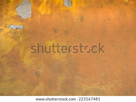 Old rustic yellow painted stone texture/background