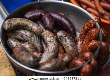 Hungarian homemade meat delicacies (sausages) at a farmers\' Sunday market in Budapest, Hungary. Selective focus