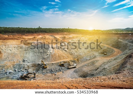 Aerial view of opencast mining quarry with lots of machinery at work - view from above.This area has been mined for copper, silver, gold, and other minerals