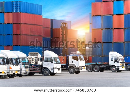 Industrial logistics and transportation of truck in Container yard for logistic and Cargo business plane at sunset
