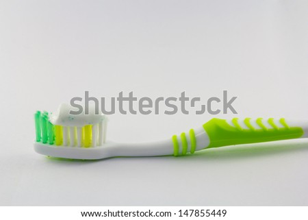 Toothbrush and toothpaste  isolated on white background
