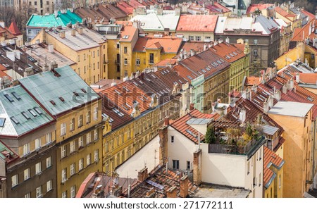 Town view from above, cityscape of vintage residential district with bright colored walls and tiled roofs near Vysehrad in Prague, Czech republic - urban background