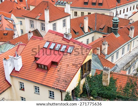 Cozy vintage houses with red tiled roofs in historical center of Prague, Czech republic