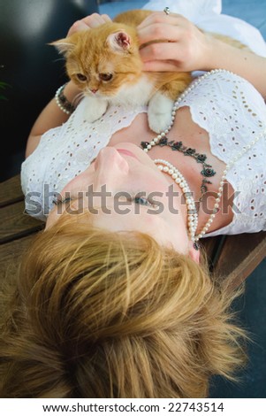 young woman with red cat