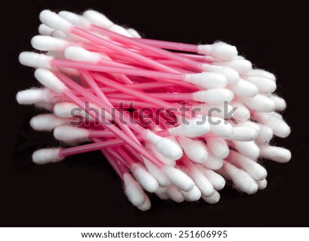 Cotton swabs isolated on black.