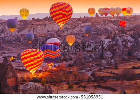 Beautiful vibrant colorful balloons in sunrise light in Cappadocia.