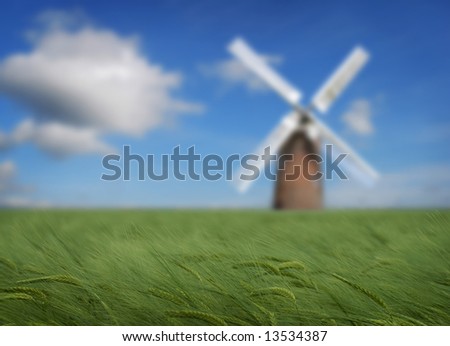 Crops with windmill in the distance, energy conservation theme