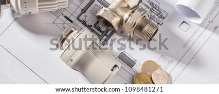 Thermostatic Head Valve for Radiator Heater Coin Money notepad for entries Heating Project Boiler room house Heat Supply Building Concept of Energy saving and conservation to pay for public service.