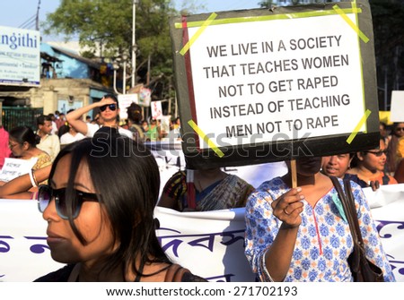 A women holding a poster against rape at women day rally on March 19, 2015 in Calcutta, India