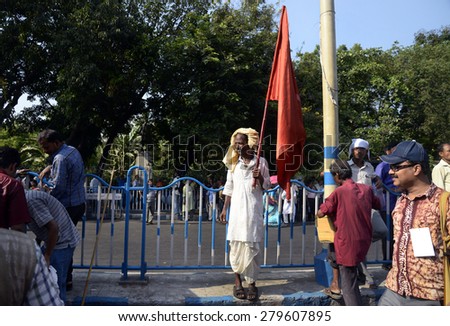 Leftist activist standing with red flag on occasion of Law Break program called by Left parties on May 13, 20105 in Calcutta, India.