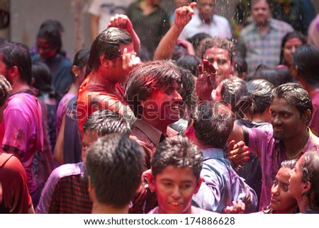 People throw colors to each other during the Holi celebration on March 27, 2013, Mumbai, Maharashtra, India. Holi is the most celebrated religious color festival in India.
