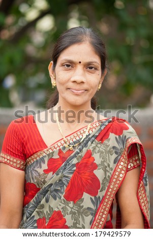 an Indian woman in traditional clothing - Sari