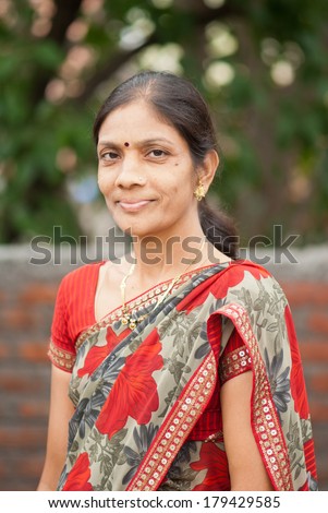 an Indian woman in traditional clothing - Sari