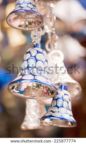 Hanging blue and silver colored jingle bells during Christmas fesival