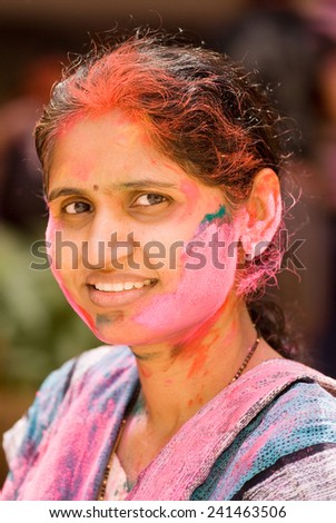 A lady play HOLI an Indian color festival at Mumbai Maharashtra India Asia South East Asia