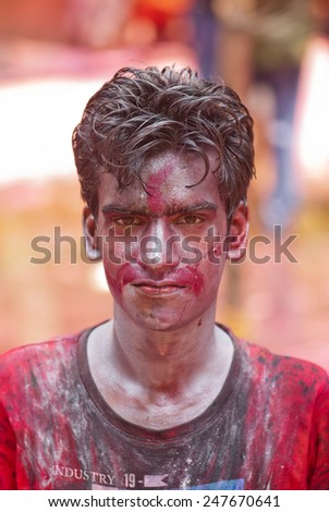 Close-up of young boy face painted with silver color on Indian color festival called HOLI on March 17, 2014, Mumbai Maharashtra India South East Asia