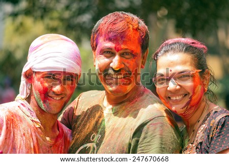 Indian Family celebrating Indian color festival called HOLI on March 17, 2014, Mumbai Maharashtra India South East Asia